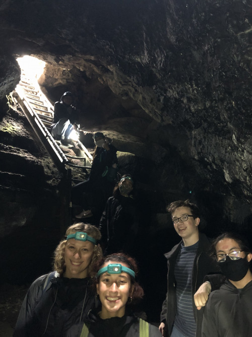 Xplore group with headlamps in the Ape Caves