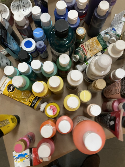 An overhead view of paint bottles at the BLM Art Event at The Armory in Portland, Oregon on April...
