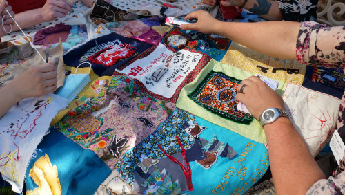 Members of Art for Social Change met to work on the Pandemic Quilt