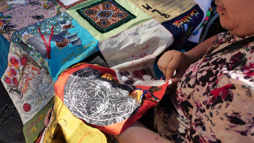 Members of Art for Social Change met to work on the Pandemic Quilt