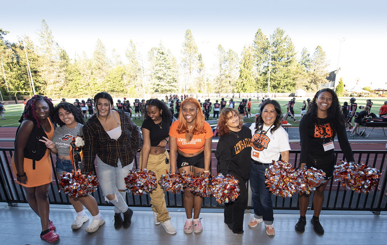 Our Cheer and Step team, along with Vice President of Student Life Evette Castillo Clark, show their school spirit at the homecoming foot...