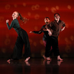 Students dancing against a red background.