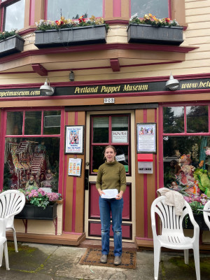 Lucy Clifford BA '24 stands outside the Portland Puppet Museum in Sellwood. This building served ...