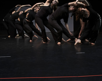 Students preparing for their Dance X performance at a second showing rehearsal.