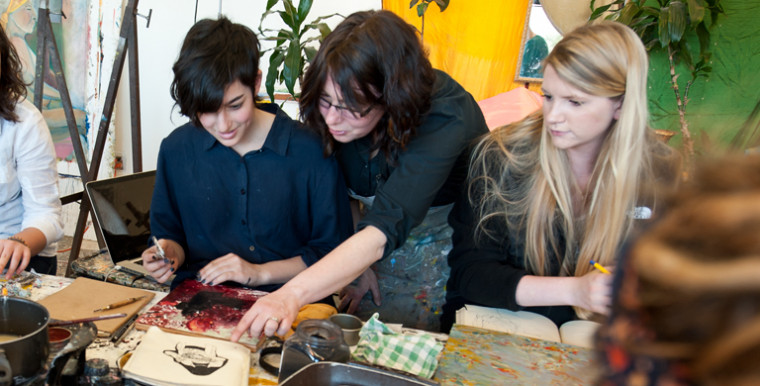 Cara Tomlinson, associate professor of art, works with students