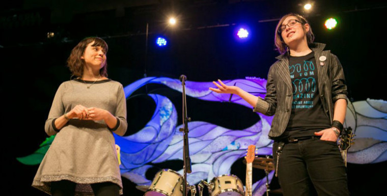 Molly Gray, right, talks about the Rock 'n' Roll Camp for Girls at a TEDxConcordia event. (Photo by Armosa Studios)
