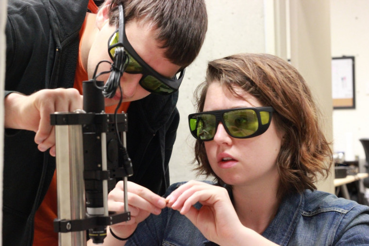 Reuben Peterson '14 and Amaya Lucas '15 conduct research with holographic optical tweezers.