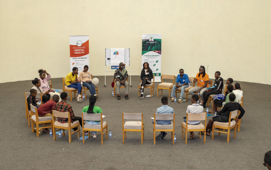 Participants sitting in a circle, talking.