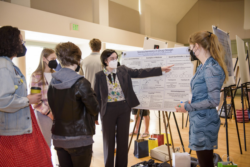 Student presenting their research poster during Festival of Scholars and Artists 2022.